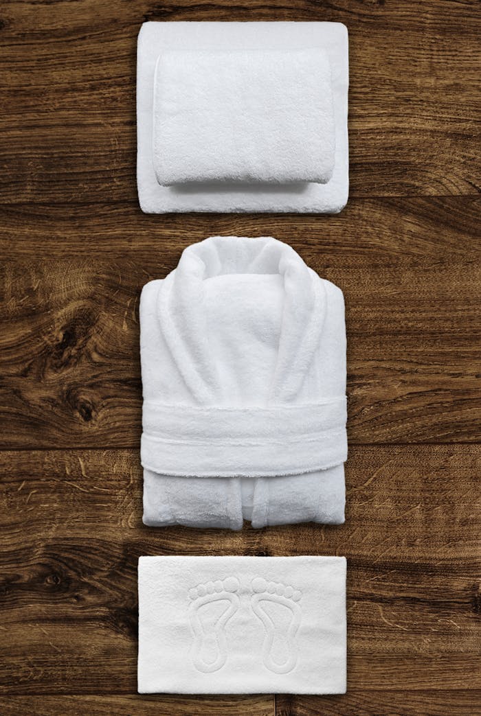 Top View of Neatly Folded Towels and a Bathrobe
